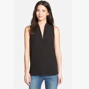 Aritzia Minimalist black sleeveless top.My fave office shirt to dress up or down